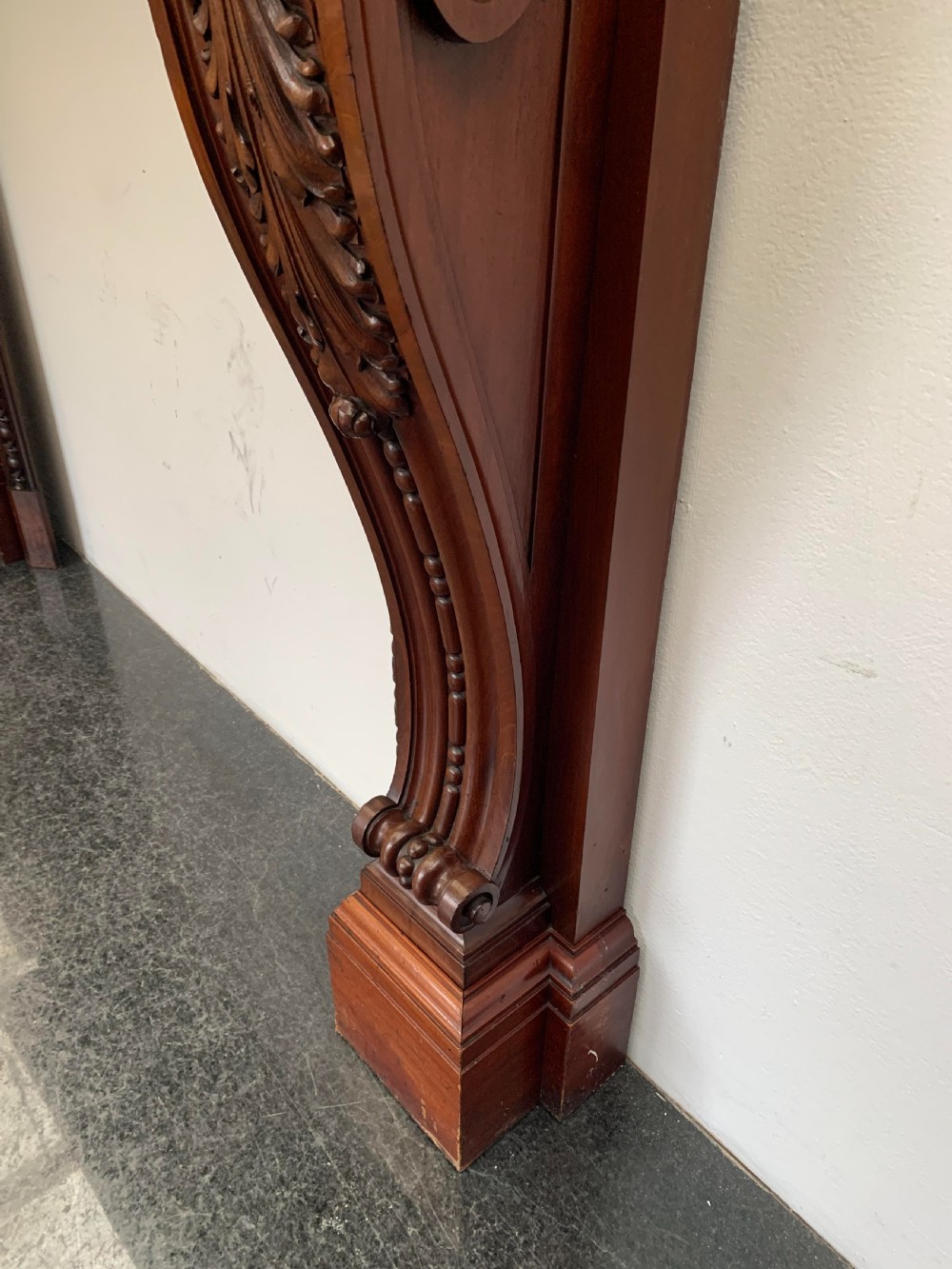 A Victorian carved mahogany fireplace surround featuring prominent acanthus leaf corbels, bead moulding, and a carved central frieze. View VIII