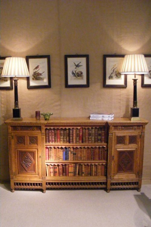 Rare and Unusual Oak Stamped Gillow Bookcase with Carved Panels and Spindle Moulding. C. 1860