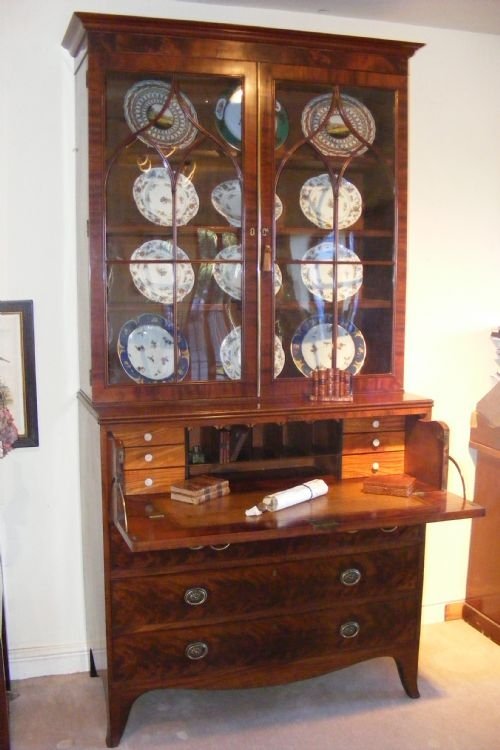 fig 1. George III Secretaire Bookcase. With Fitted Drawers, Glazed original upper section, Brass Bail Handles, Standing On Bracket Feet, Original Top And Bottom.
