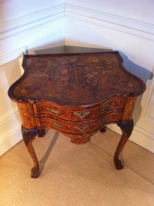 fig 3. Unusual Dutch walnut Serpentine marquetry table