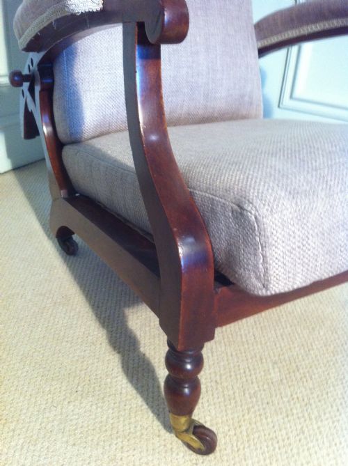 fig 2. Unusual mahogany reclining campaign chair newly upholstered by J Shoolbred.