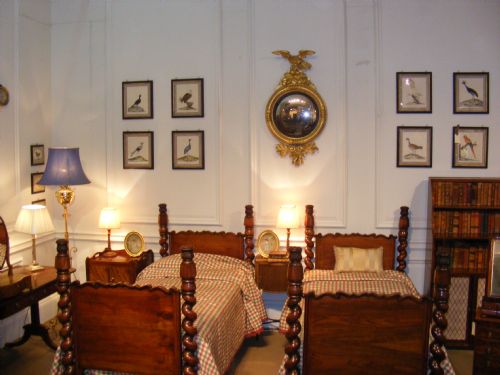 fig 1. A pair of Regency rosewood single bedsteads featuring hand-carved spiral twist corner posts and shaped headboards.