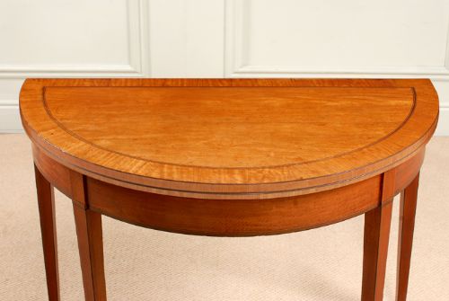 fig 1. Sheraton satinwood demi-lune tea table.