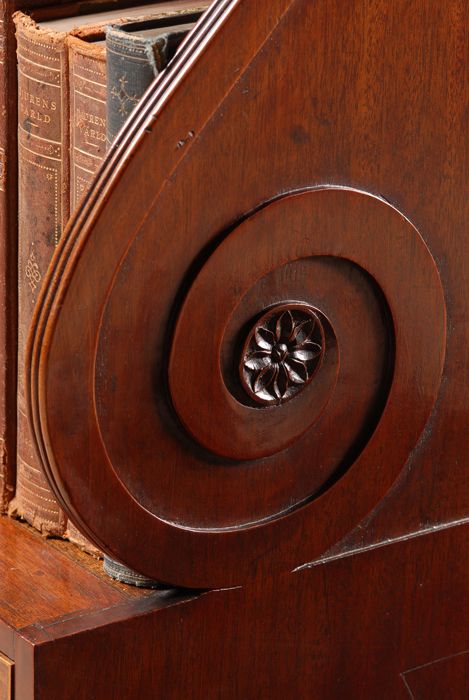 fig 3. Regency mahogany Hepplewhite style bookcase with two drawers and carved & reeded decoration.