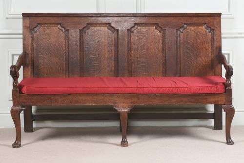 A large 18th century oak settle in superb condition