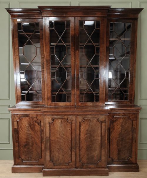 19TH CENTURY FIGURED MAHOGANY BREAKFRONT BOOKCASE