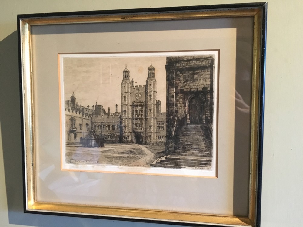 A framed Victorian monochrome etching depicting Luptons Tower at Eton College, set within a cream mount and a black and gold frame.