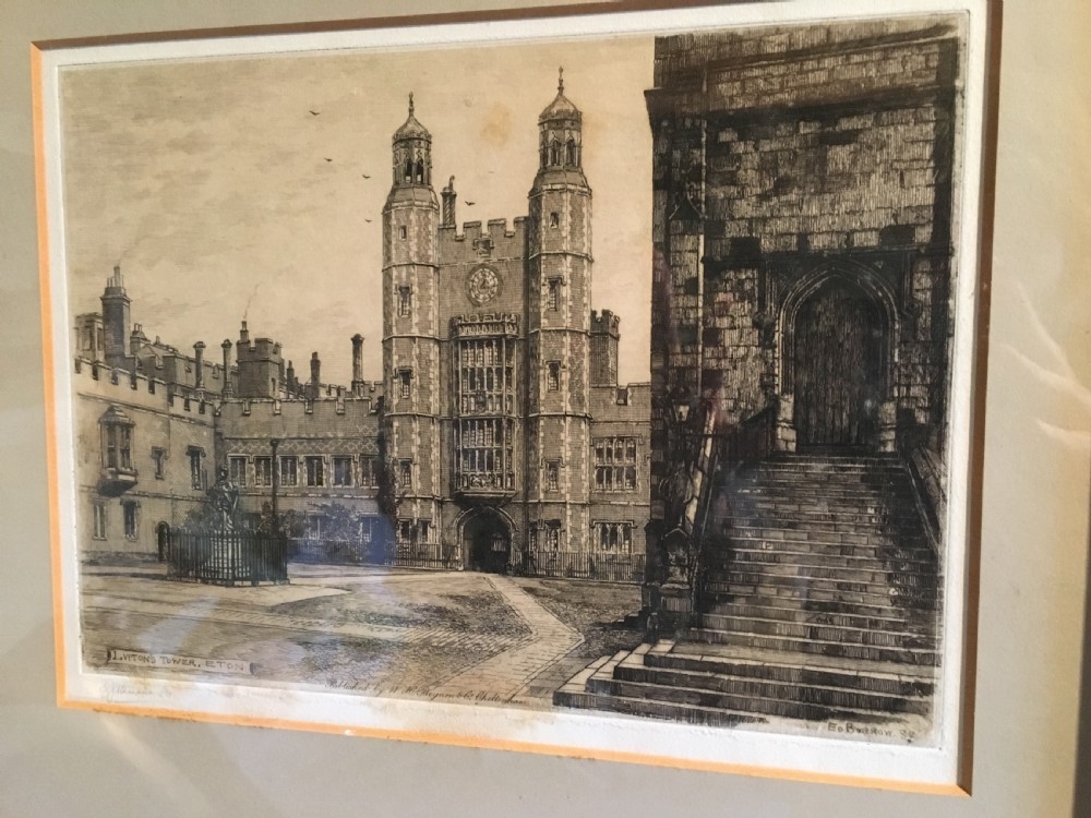 A framed Victorian monochrome etching depicting Luptons Tower at Eton College, set within a cream mount and a black and gold frame. View II