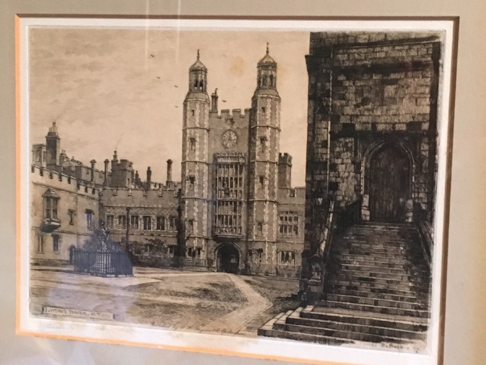 A framed Victorian monochrome etching depicting Luptons Tower at Eton College, set within a cream mount and a black and gold frame. View IX