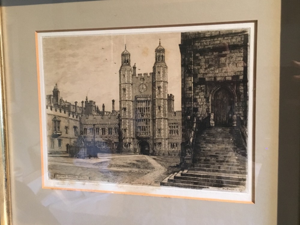 A framed Victorian monochrome etching depicting Luptons Tower at Eton College, set within a cream mount and a black and gold frame. View XIV