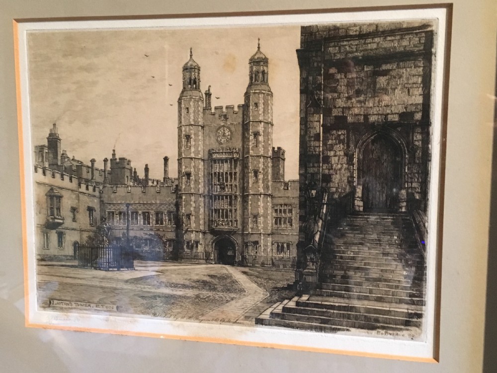A framed Victorian monochrome etching depicting Luptons Tower at Eton College, set within a cream mount and a black and gold frame. View XV