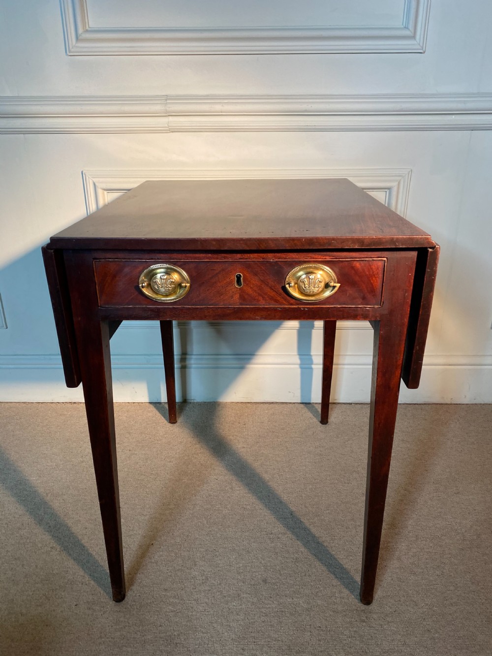 An 18th-century Chippendale mahogany Pembroke table with drop leaves, a single drawer featuring oval brass handles, and square tapered legs. View II
