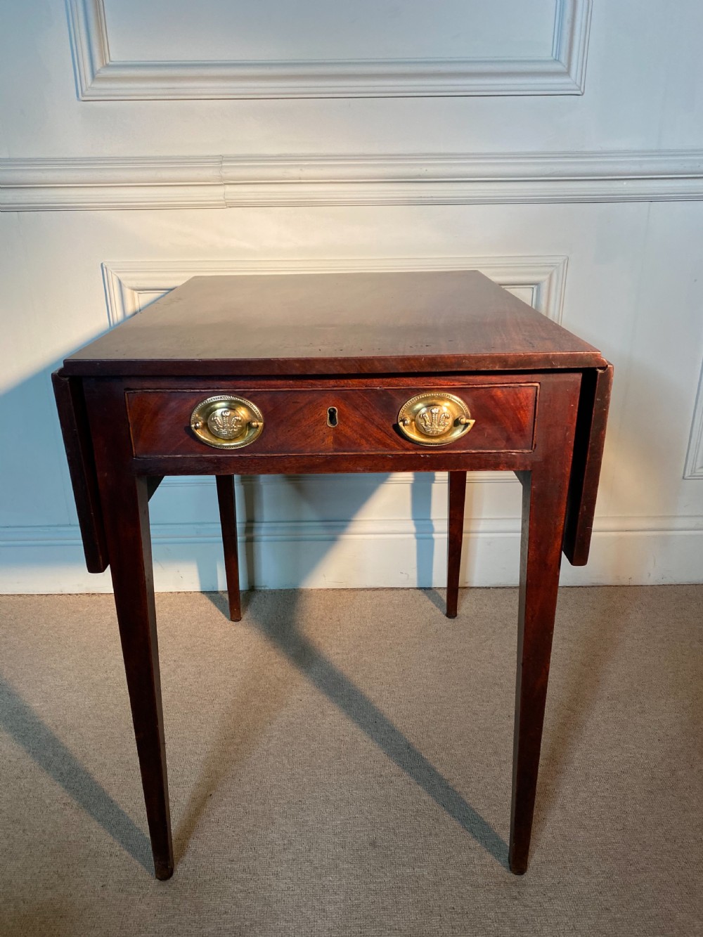 An 18th-century Chippendale mahogany Pembroke table with drop leaves, a single drawer featuring oval brass handles, and square tapered legs. View III