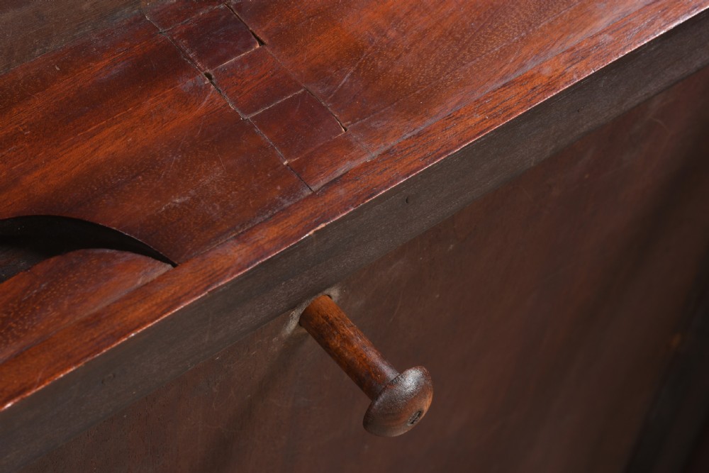A 19th-century mahogany games table featuring a square top with an inlaid chessboard, two drop-leaf sides, reeded turned legs, and an X-stretcher with a central finial. View VII