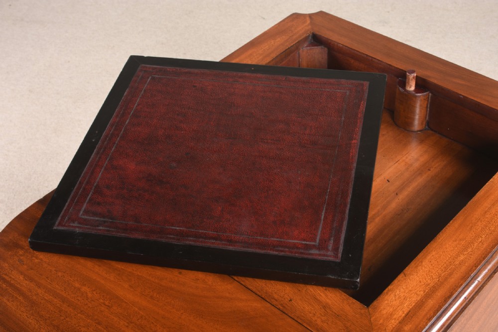 A 19th-century mahogany games table featuring a square top with an inlaid chessboard, two drop-leaf sides, reeded turned legs, and an X-stretcher with a central finial. View VIII