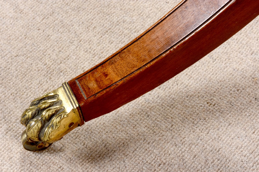 An eighteenth-century George III mahogany cheval dressing mirror with turned uprights, finials, a tilting rectangular mirror frame, and splayed legs with brass paw castors. View VI