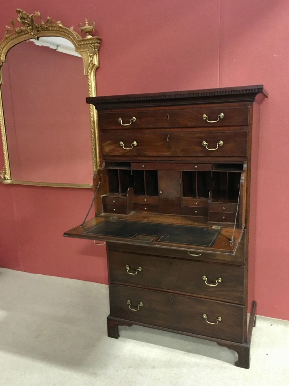 A tall George III mahogany secretaire tallboy featuring seven graduated drawers, brass swan-neck handles, dentil moulding, and bracket feet. View VIII