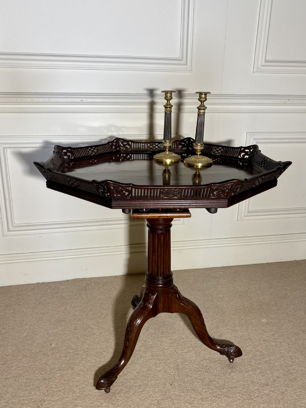 An 18th-century mahogany octagonal tripod table featuring a pierced fretwork gallery, fluted central column, and carved cabriole legs. View II