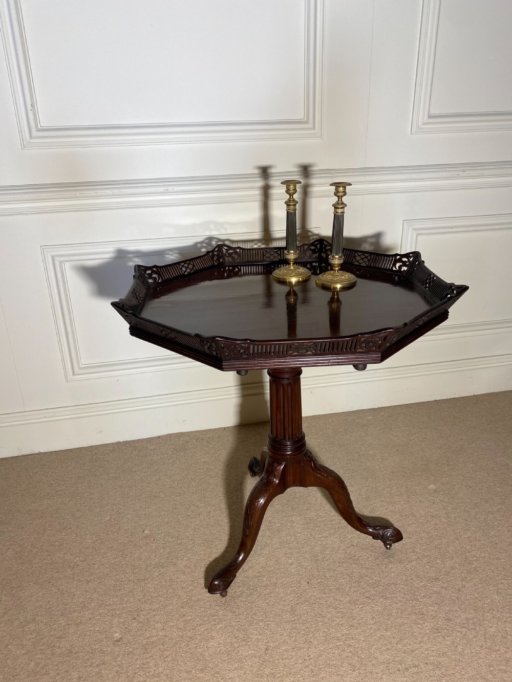 An 18th-century mahogany octagonal tripod table featuring a pierced fretwork gallery, fluted central column, and carved cabriole legs. View III