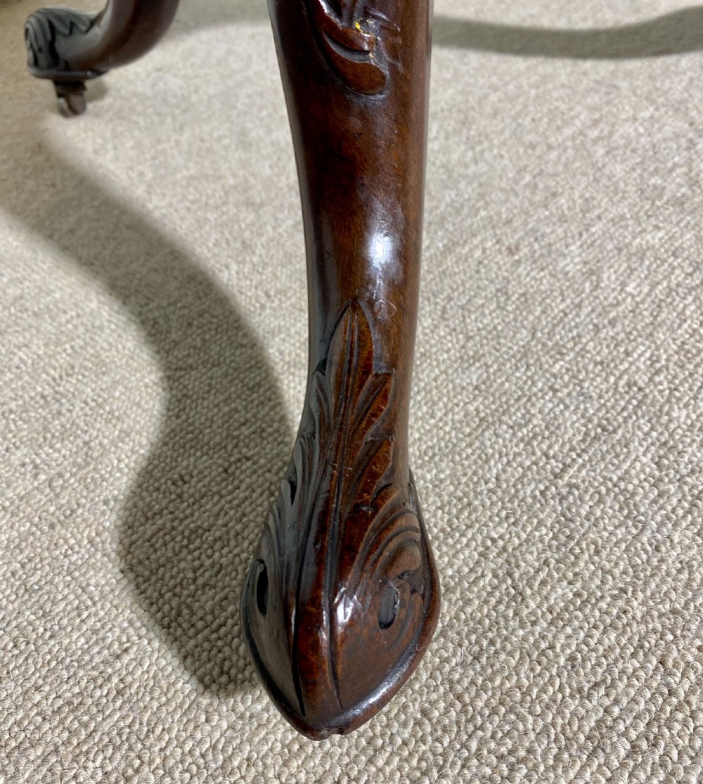 An 18th-century mahogany octagonal tripod table featuring a pierced fretwork gallery, fluted central column, and carved cabriole legs. View VIII