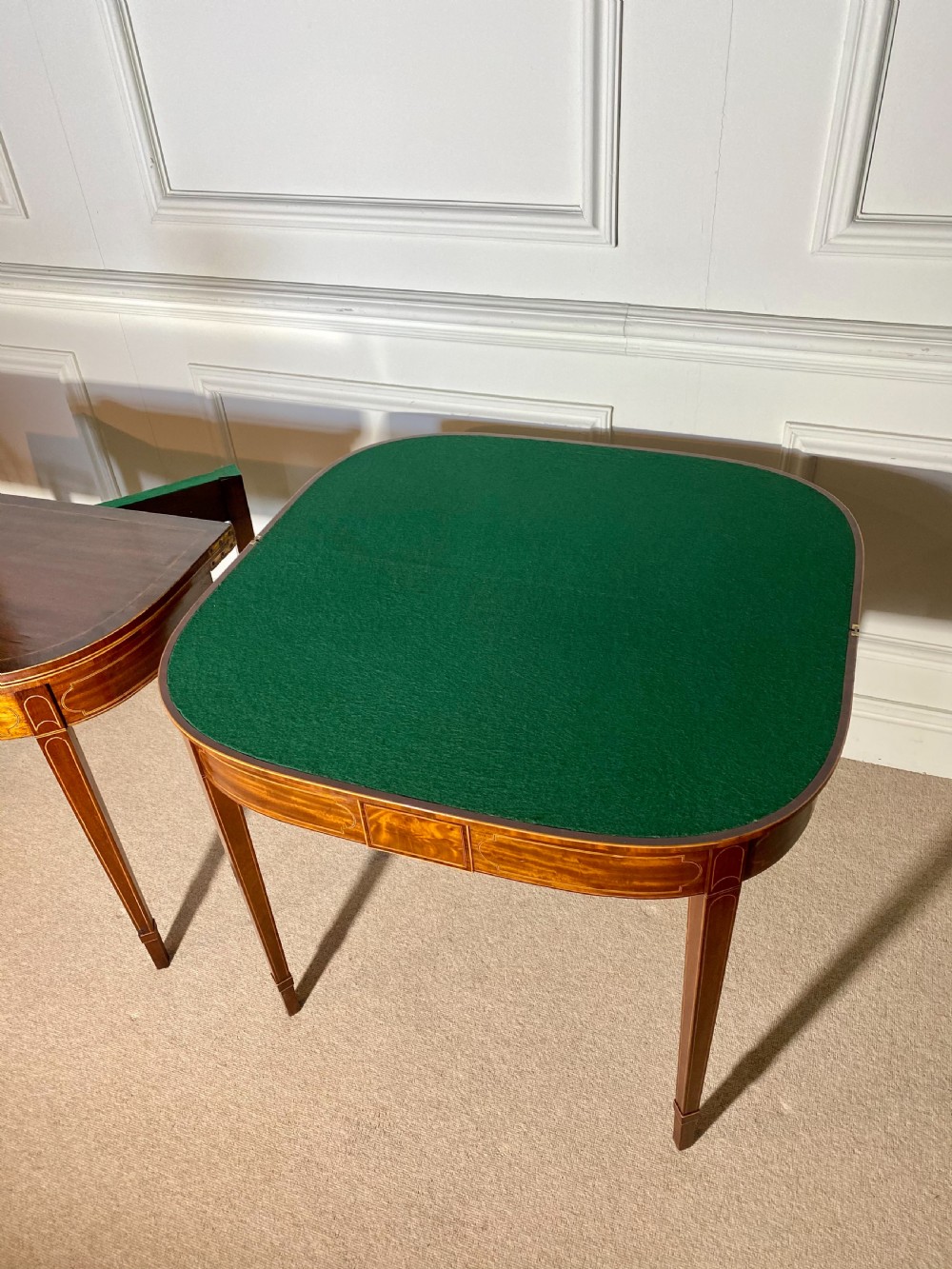A pair of 18th-century George III mahogany demilune card tables with satinwood crossbanding, boxwood stringing, and square tapered legs. View II