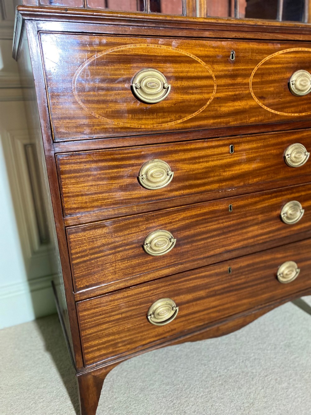 An 18th-century George III mahogany secretaire bookcase featuring an upper double-door glazed cabinet with arched astragal glazing, an open drop-front writing drawer with internal pigeonholes, and lower drawers with brass oval handles. View XI