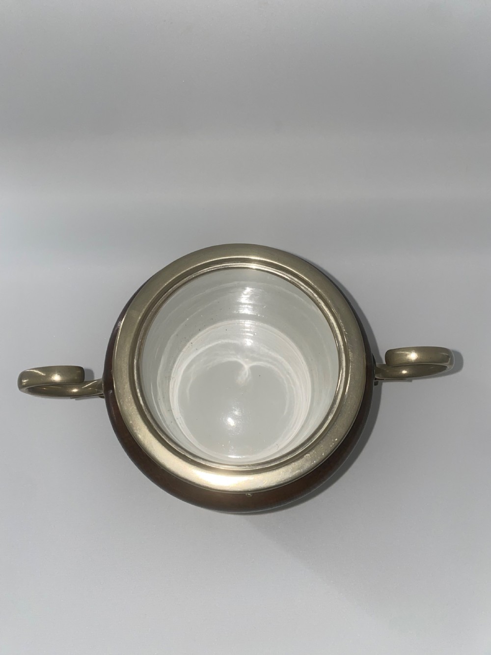 A turned oak ice bucket featuring silver-plated scroll handles, a shield-shaped front cartouche, and a domed metal lid with a finial. View III