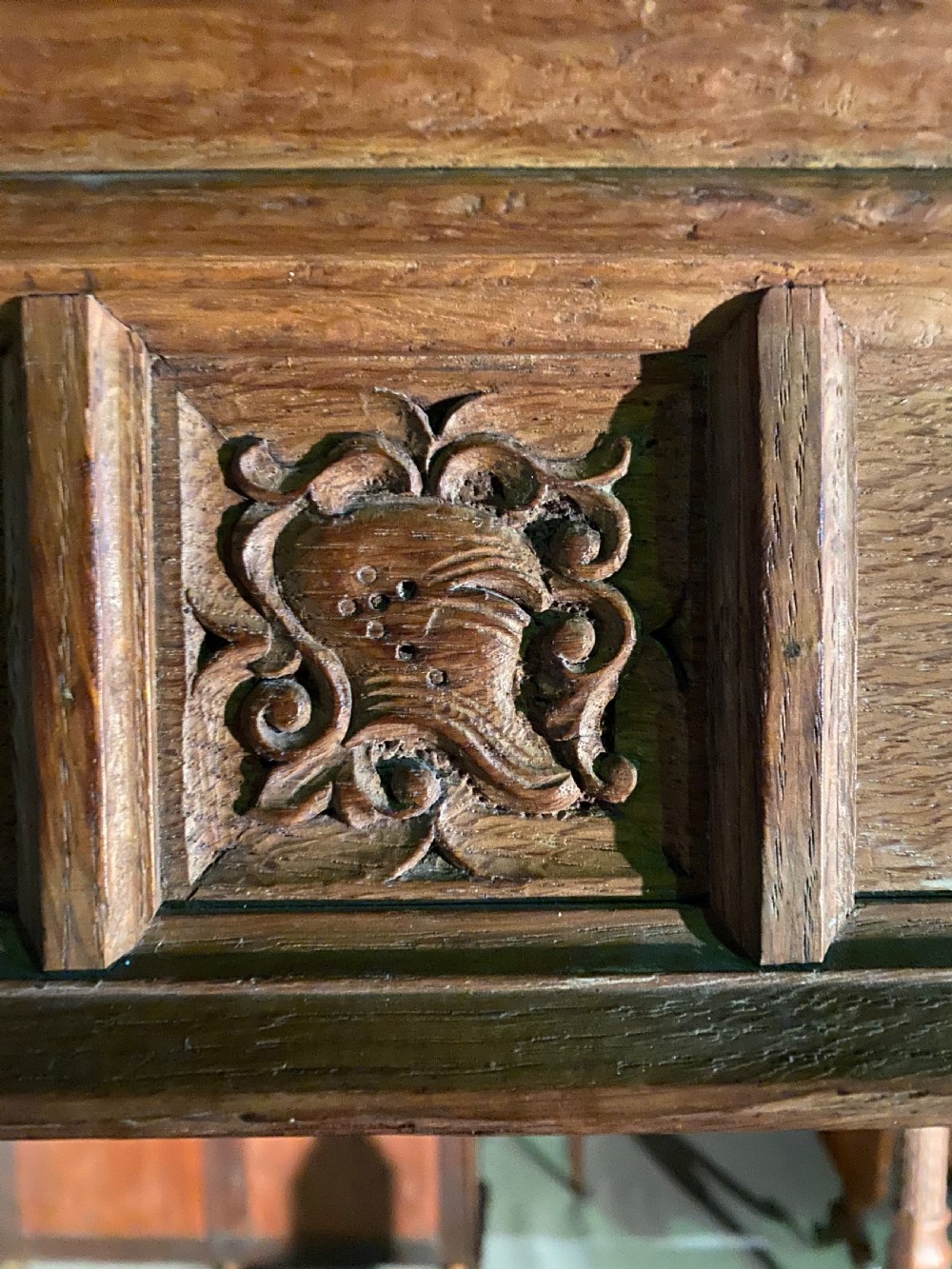An Arts and Crafts oak four poster bed frame featuring carved upright posts and a decorative upper frieze canopy structure. View VI