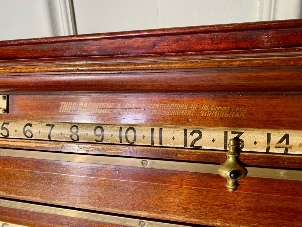 An antique Victorian mahogany and brass snooker scoreboard featuring sliding pointer markers and numbered tracks. View VII