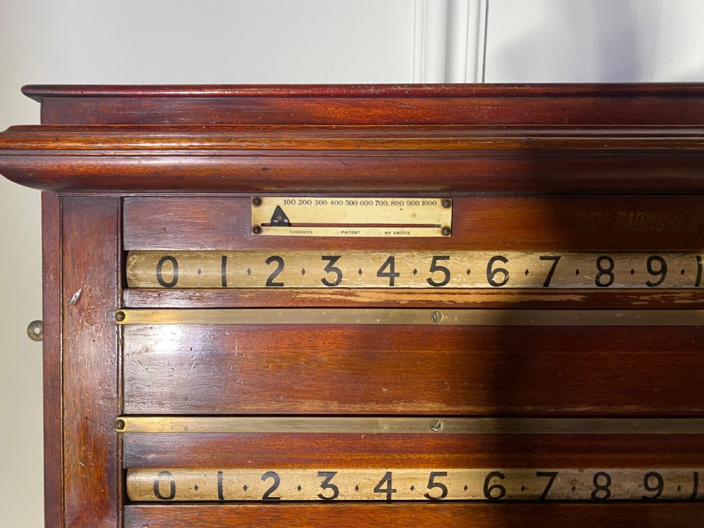 An antique Victorian mahogany and brass snooker scoreboard featuring sliding pointer markers and numbered tracks. View VIII