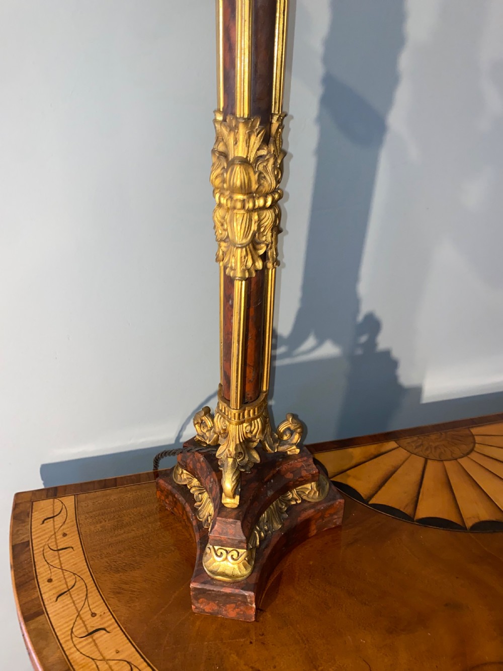 A pair of Neoclassical style gilt bronze and red marble candelabra table lamps featuring scroll arms and candle sockets. View VII