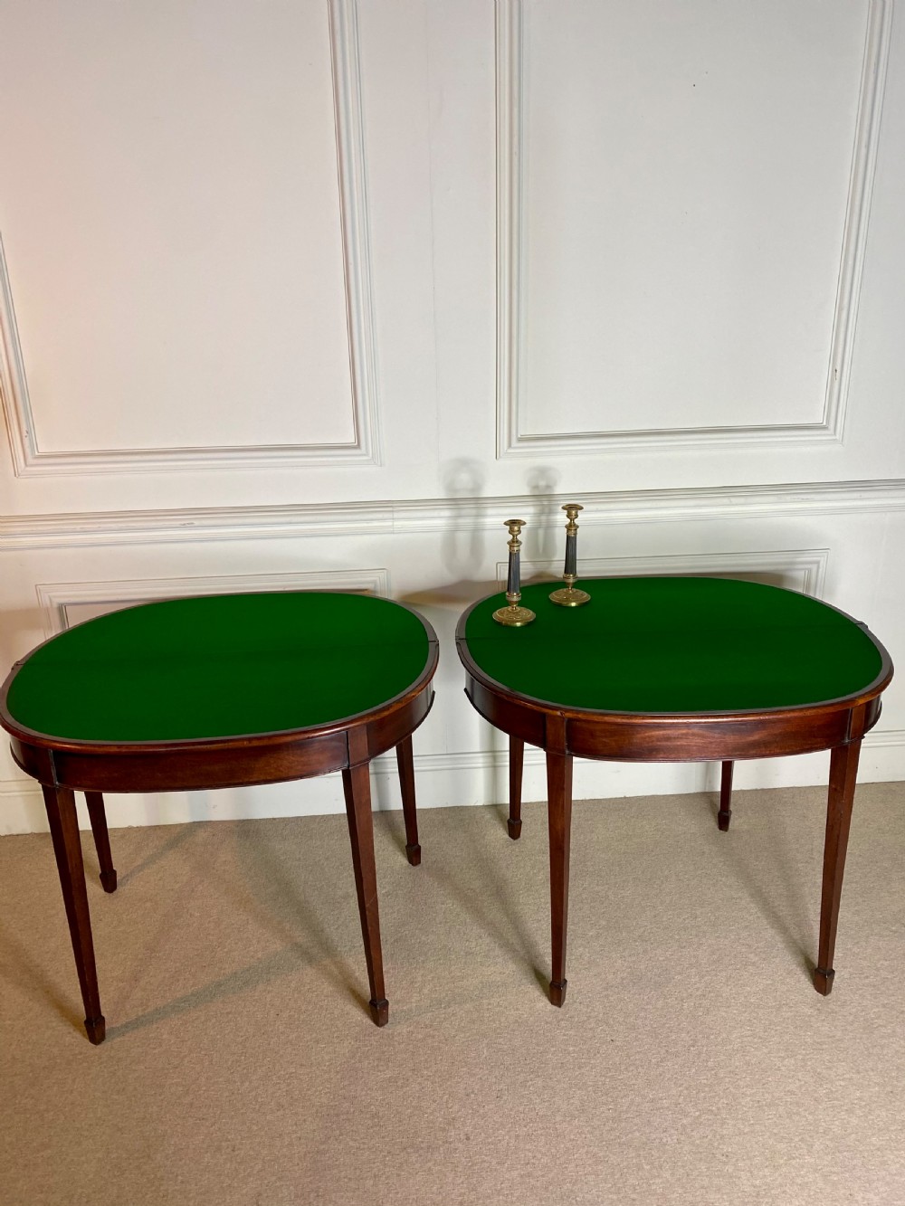 A pair of late eighteenth-century Georgian mahogany demilune card tables with fold-over tops and square tapered legs. View IV