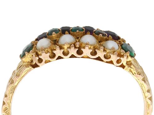 fig 1. A Victorian 15ct yellow gold dress ring set with multiple rows of emeralds, amethysts, and pearls featuring carved shoulders.
