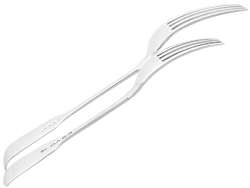 fig 7. An antique Victorian sterling silver cutlery set in the Fiddle pattern, featuring knives, forks, spoons, and ladles arranged on a plain white background.
