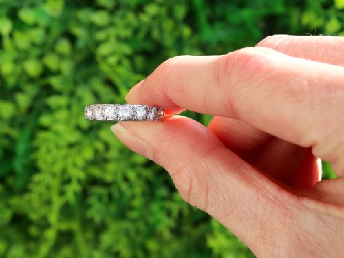 fig 1. A platinum full eternity ring set with a continuous band of round brilliant cut diamonds in claw settings.