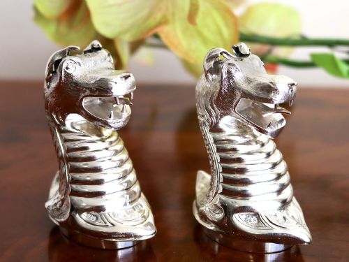 fig 2. A pair of antique Victorian sterling silver pepper casters sculpted in the form of detailed dragon heads.