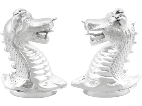 fig 3. A pair of antique Victorian sterling silver pepper casters sculpted in the form of detailed dragon heads.