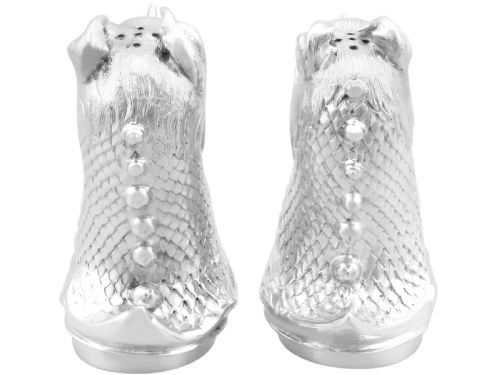 fig 4. A pair of antique Victorian sterling silver pepper casters sculpted in the form of detailed dragon heads.