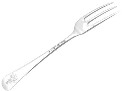 fig 3. A set of twelve antique sterling silver table forks featuring three tines and smooth Hanoverian pattern handles arranged side by side.