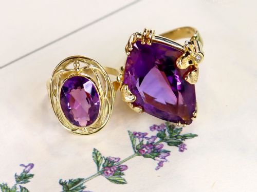 fig 2. A vintage 14ct yellow gold dress ring featuring a large faceted purple amethyst with textured claw settings and small diamond accents.