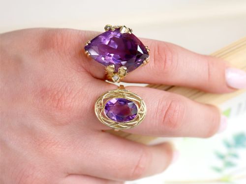 fig 3. A vintage 14ct yellow gold dress ring featuring a large faceted purple amethyst with textured claw settings and small diamond accents.