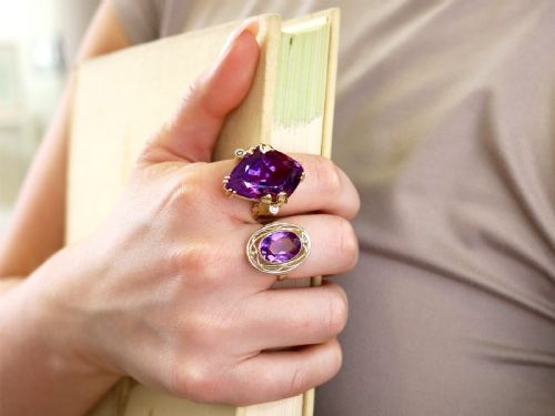 fig 4. A vintage 14ct yellow gold dress ring featuring a large faceted purple amethyst with textured claw settings and small diamond accents.