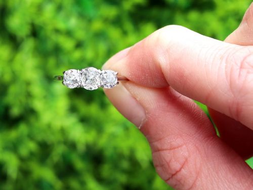 fig 1. An antique 18ct white gold and platinum trilogy ring set with three prominent old cut diamonds in a claw setting.