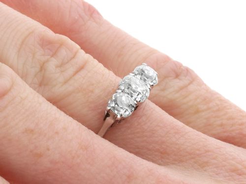 fig 7. An antique 18ct white gold and platinum trilogy ring set with three prominent old cut diamonds in a claw setting.