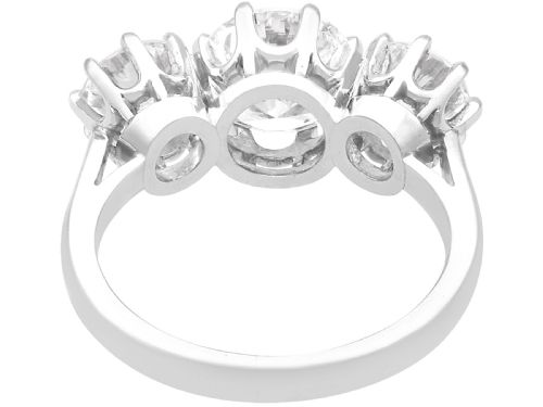 fig 4. A platinum trilogy ring featuring three round brilliant cut diamonds set in individual multi-claw settings along a polished platinum band.