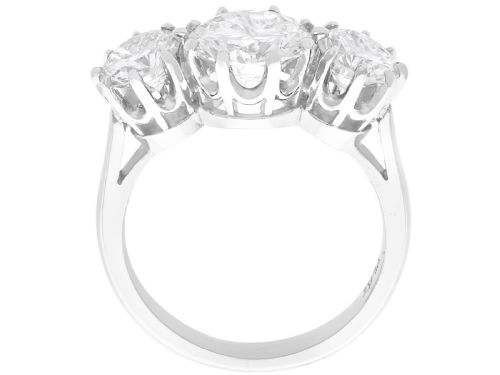 fig 5. A platinum trilogy ring featuring three round brilliant cut diamonds set in individual multi-claw settings along a polished platinum band.