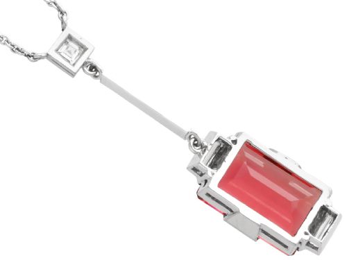 fig 4. An Art Deco 18ct white gold pendant featuring a rectangular step-cut red tourmaline suspended from a bar link set with accent diamonds.