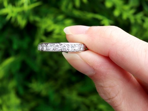 fig 1. An 18ct white gold full eternity ring set with a continuous circle of brilliant-cut diamonds and featuring a pierced inner gallery.