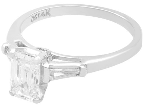 fig 2. An Art Deco 14ct white gold solitaire ring featuring a central emerald-cut diamond flanked by tapered baguette diamond shoulders.
