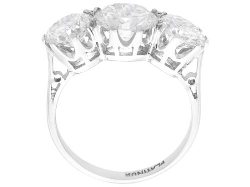 fig 7. A vintage platinum ring featuring three large round brilliant cut diamonds set horizontally in claw settings.